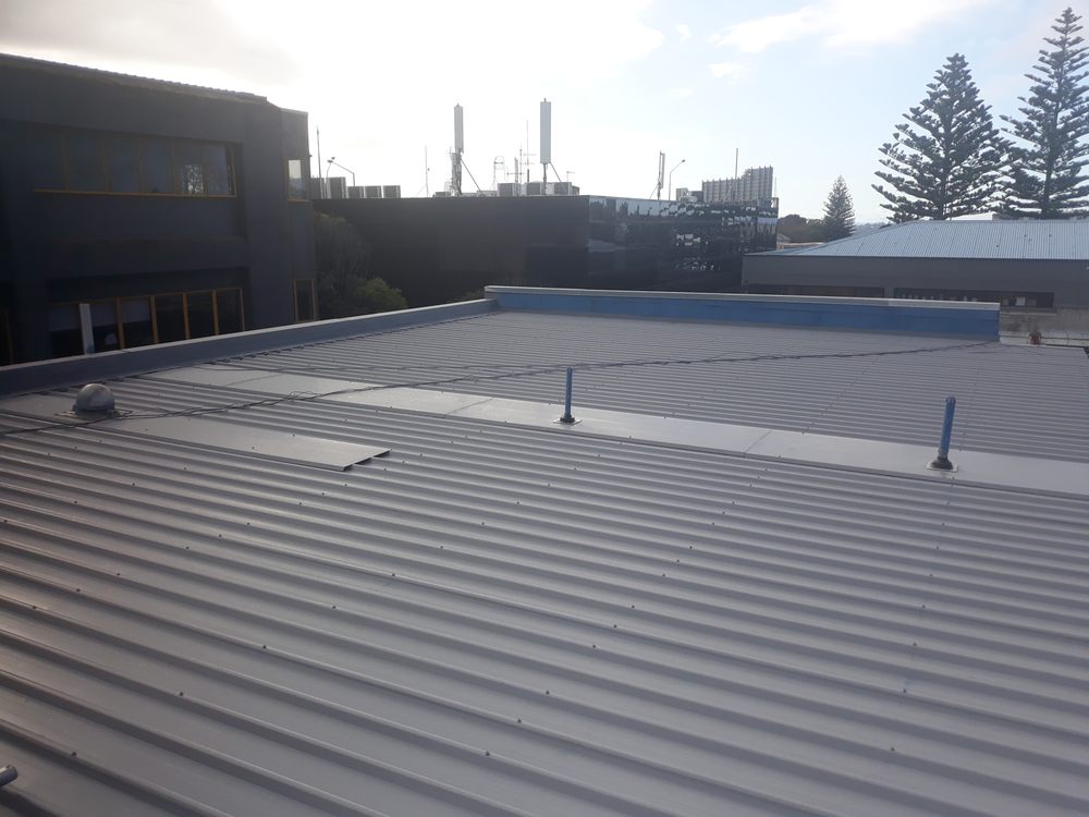 Commercial long run iron roof replacement